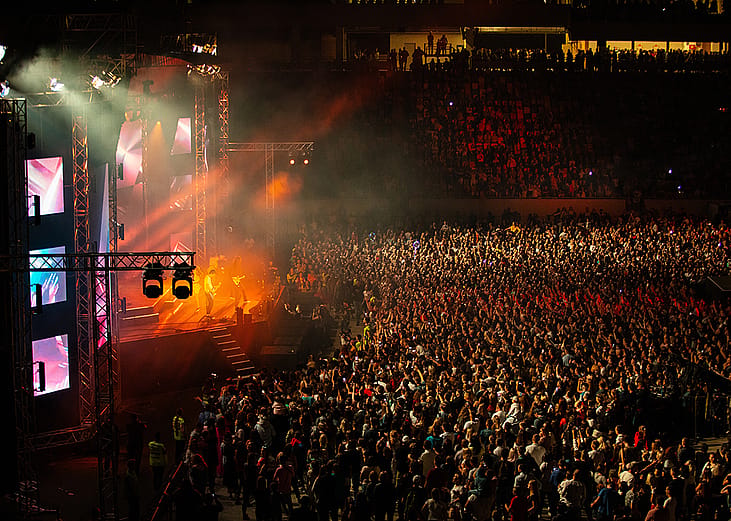 A sold out stadium during a concert performance.