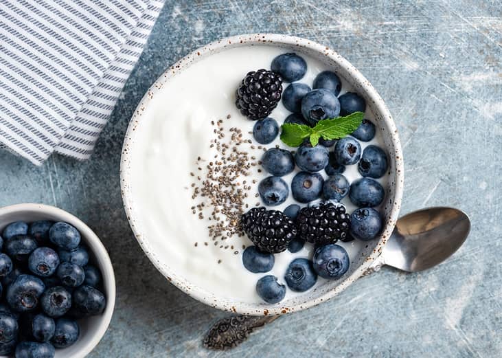 Greek yogurt bowl with blueberries, blackberries and chia seeds. 