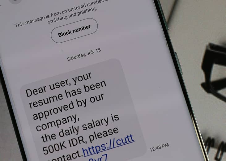 A suspicious job alert text message with a phishing link.