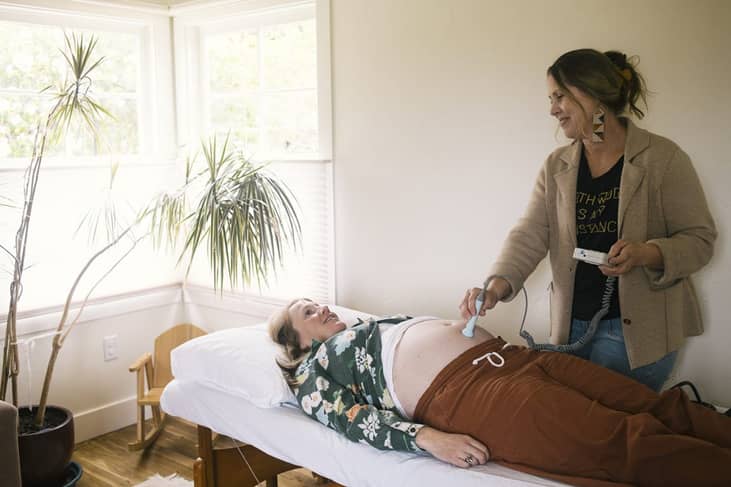 Midwife Laura Doyle listens to Leslie Booher’s baby’s heartbeat using a fetal doppler during an exam at Moonstone Midwives Birth Center on Monday, May 4, 2026 in Eureka, California.
