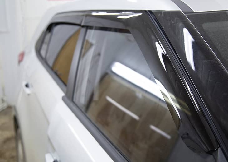 Rain guards installed on car windows