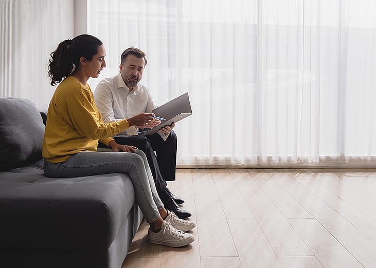 A young adult discussing health options and treatment plans with a professional.