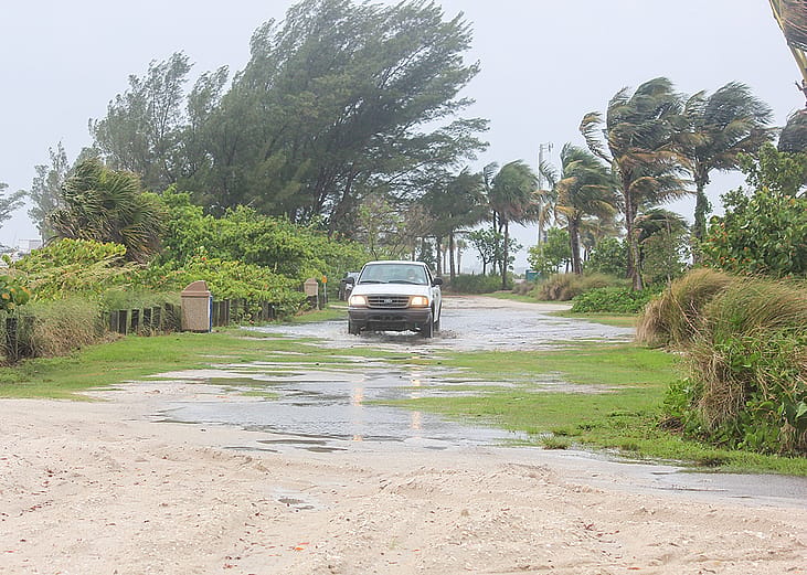 A car on the road as a hurricane passes over Florida.