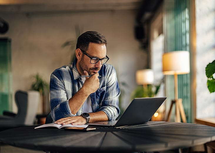 A focused businessman working on a project.