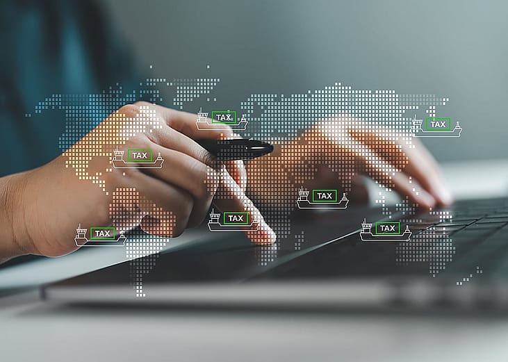 Businessman illustrated with global import and export tax graphics.