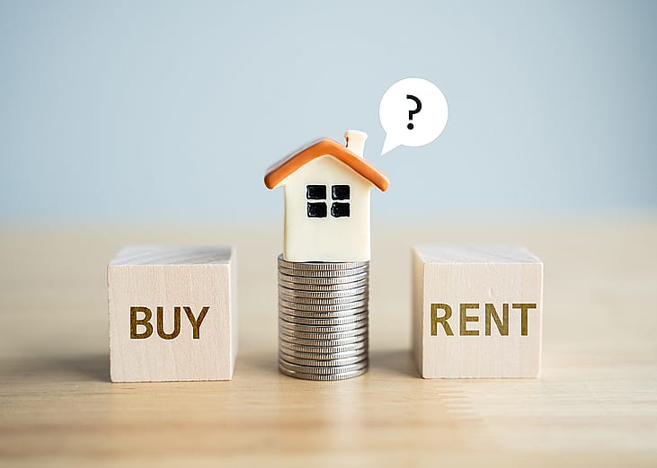 A conceptual photo of choosing between renting or buying a home.