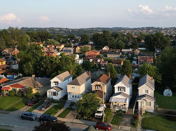 An aerial view of a row of multi-story townhouses in Pittsburgh, Pennsylvania.
