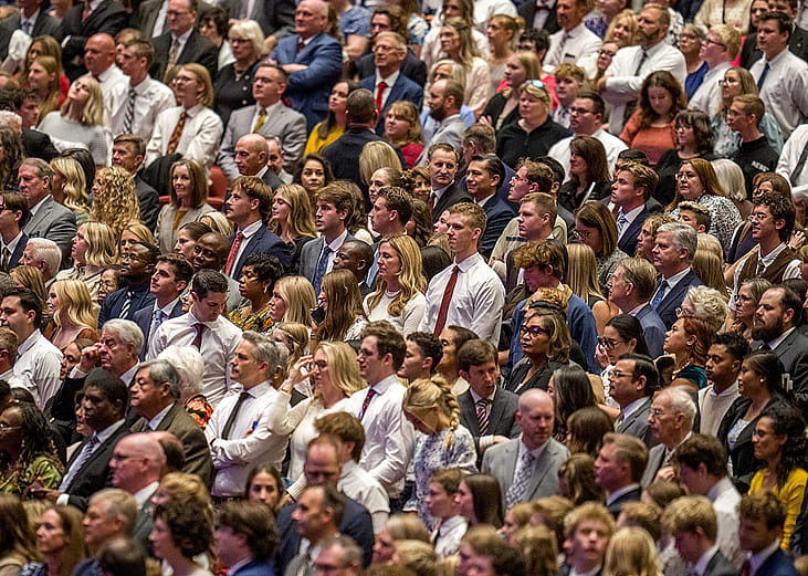 Attendees stand at the start of a General Conference session in 2025. Latter-day Saint retention has emerged as an issue in the global faith in the wake of recent research.