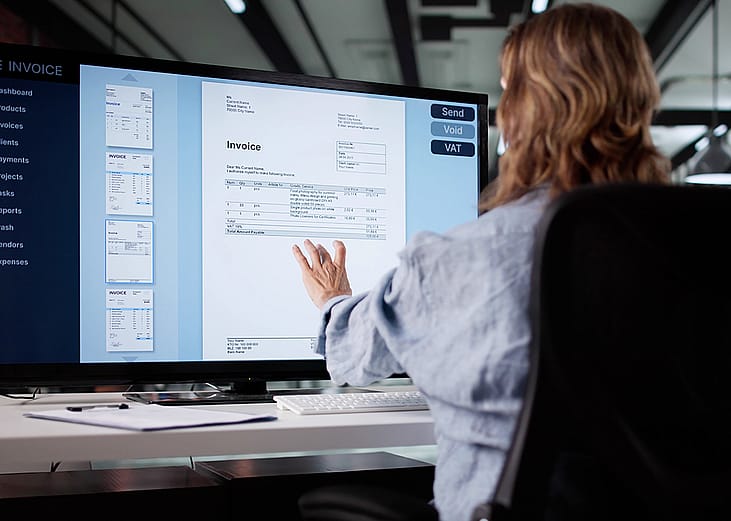 An accountant working on an invoice system.