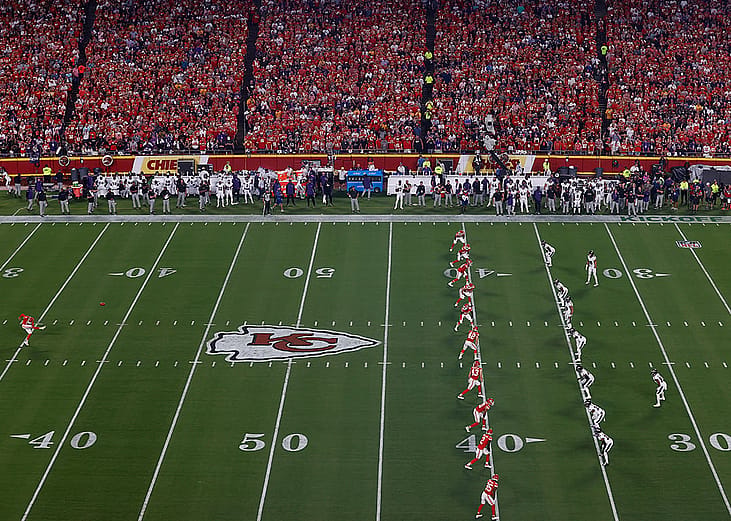 Kansas City Chiefs' No. 7 Harrison Butker kicking the ball on the games opening kickoff across Baltimore Ravens players at the Arrowhead Stadium in Kansas City, Missouri, USA.