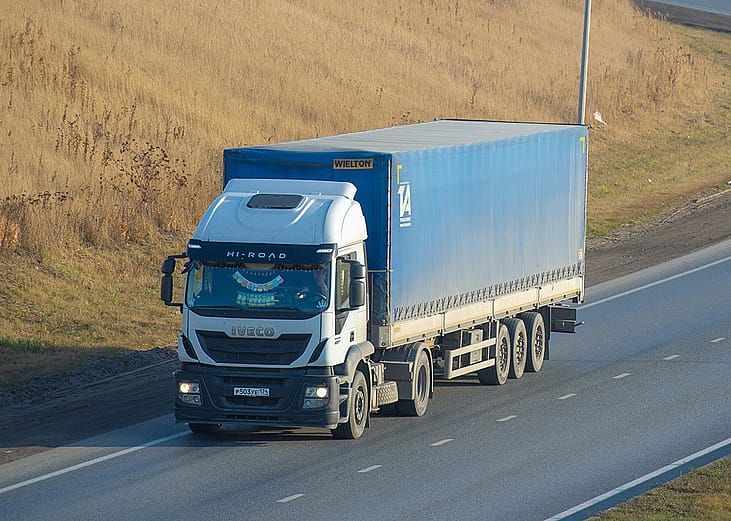 A freight truck on a highway 
