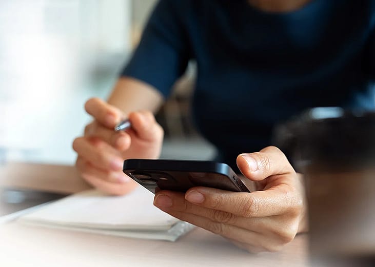 Person doing online research using a smartphone