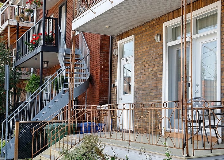 An exterior staircase seen from a residential building in town.