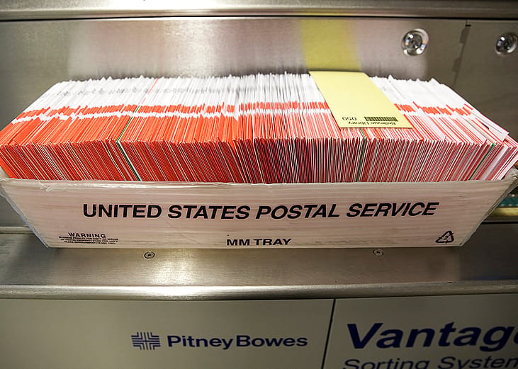 Ballots seen in a US Postal Service box on Election Day at the King County Elections office in Renton, Washington, USA.