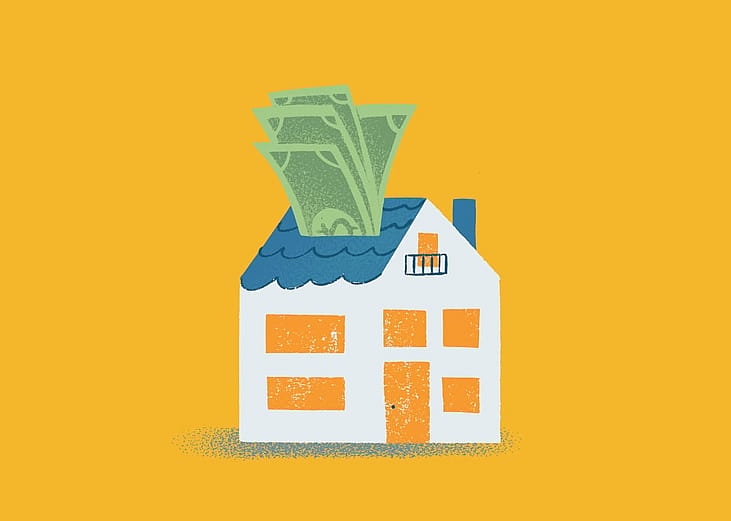 A vector illustration of a white two-story house with a blue roof, an orange door and windows, and green dollar bills sticking out of the roof.