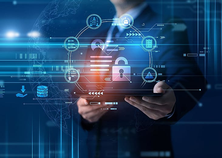 A conceptual graphic of cyber security, featuring a person holding a tablet with a digital padlock and data protection holograms.