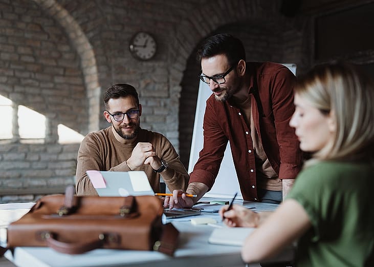 A small business team working together in a modern office.