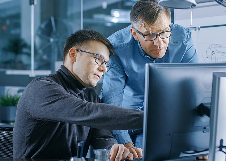 A team of senior engineers working on project.