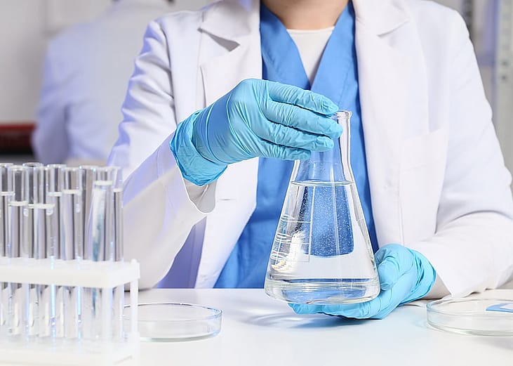 A female scientist working on water samples in a laboratory.