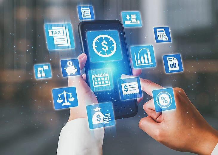 A conceptual image of digital banking and finance systems showing a person using a smartphone surrounded by floating icons for tax and finance management.