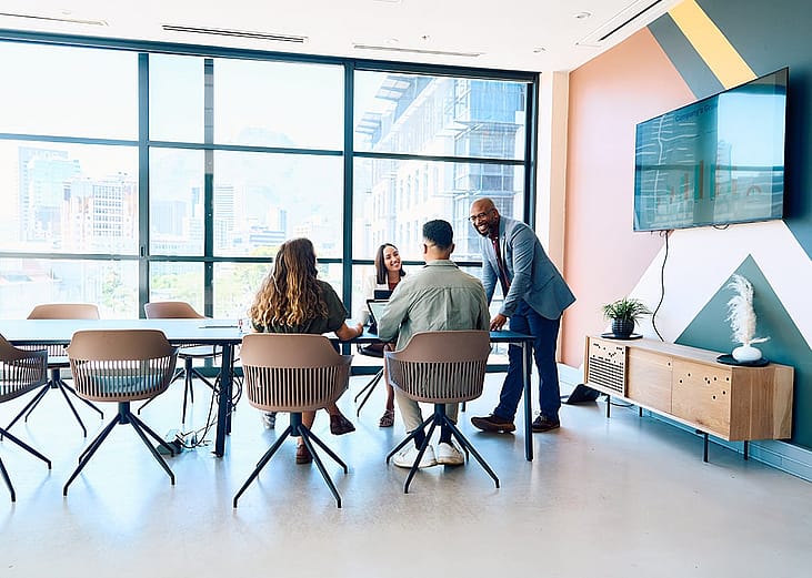 A business team in a modern office meeting room.