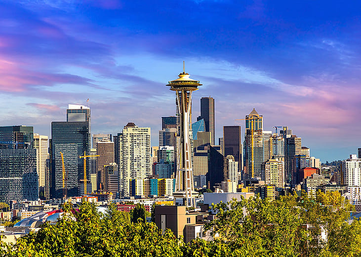 A panoramic view of Seattle cityscape at sunset.