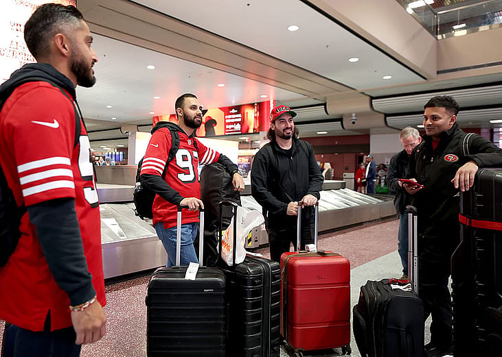 San Francisco 49er fans make their way inside Harry Reid International Airport ahead of Super Bowl LVIII on February 10, 2024 in Las Vegas, Nevada. 
