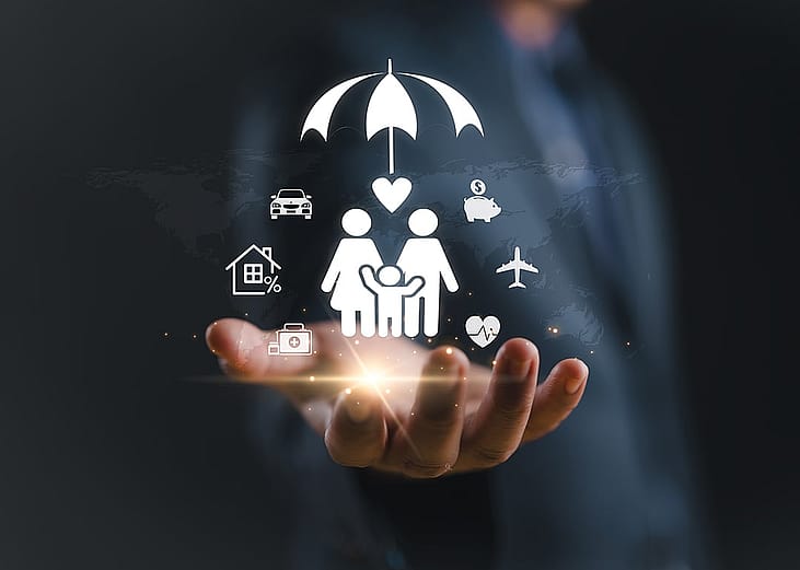 A conceptual graphic of family insurance and financial protection, featuring a person holding glowing icons of a family under an umbrella.