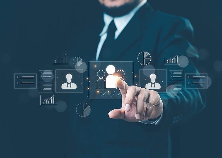 A businessman navigating an HR management system.