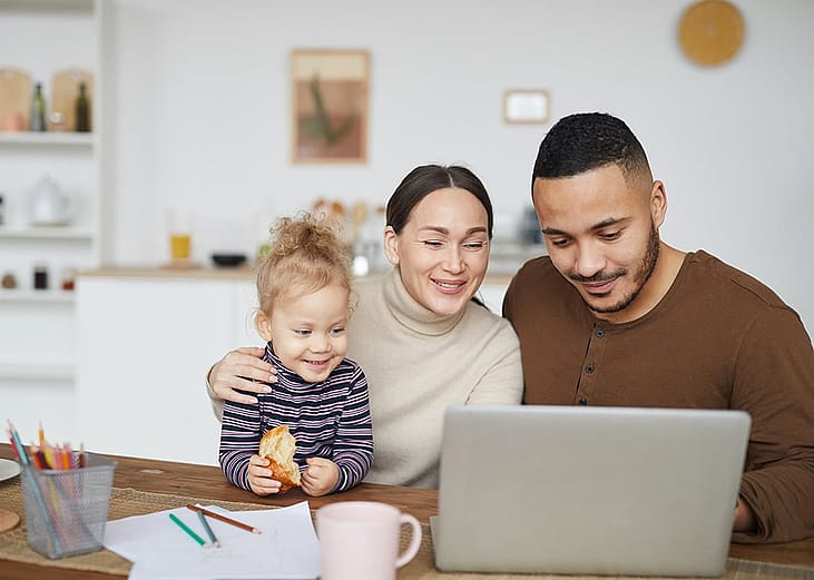 A happy family online shopping at home.