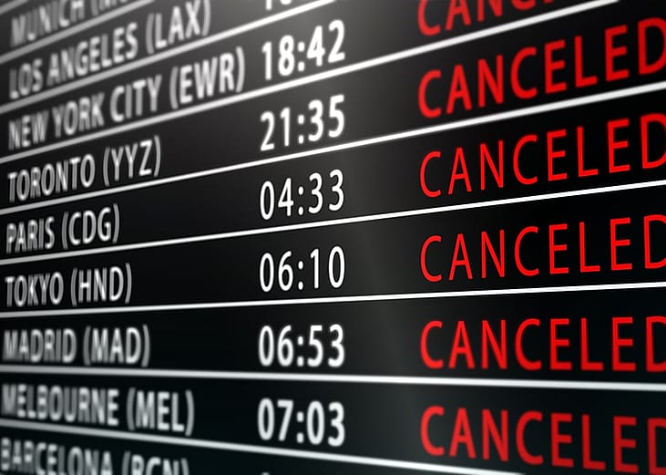 An international flight tracker board with canceled flights.
