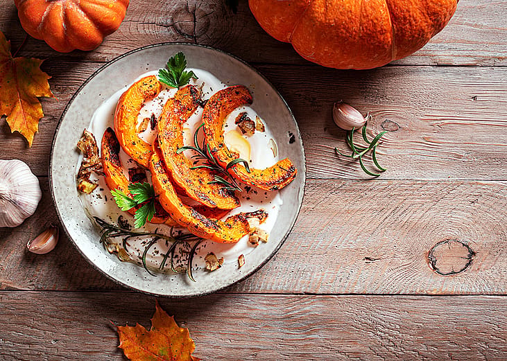 A roasted pumpkin with greek yogurt dish.