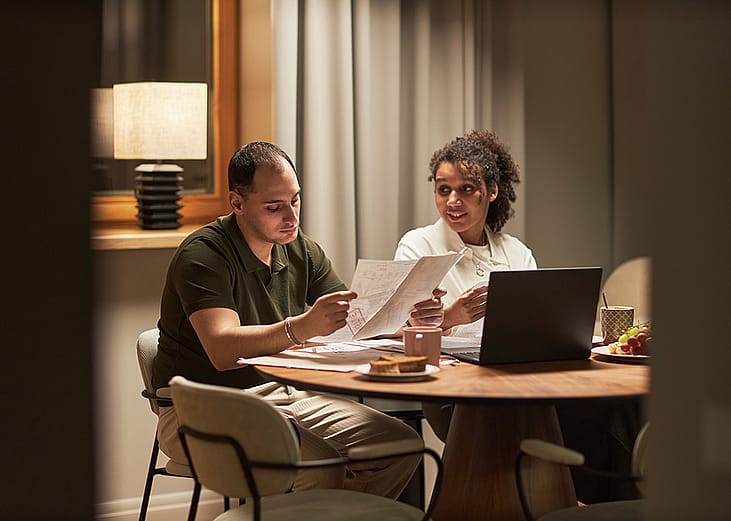 Business partners reviewing documents together for their new financial venture.