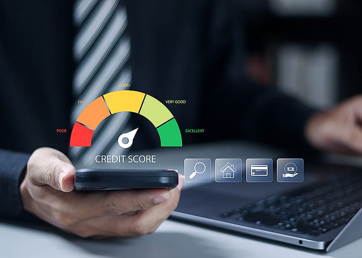 A businessman checking his personal rank through a credit score meter from his smartphone.
