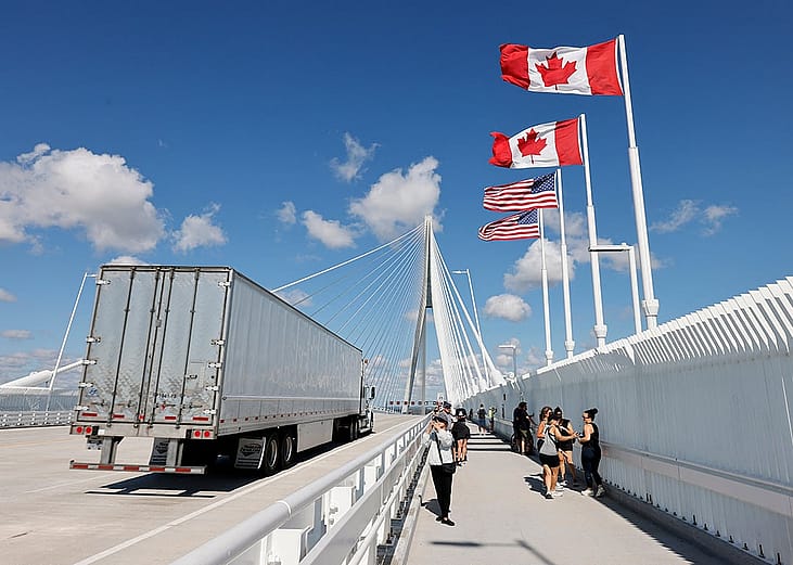 A truck crossing into the United States through the Gordie Howe International Bridge, connecting Windsor, Ontario, Canada and Detroit, Michigan, USA.