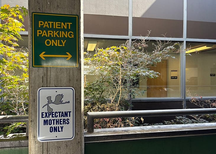 A sign outside a hospital’s maternal-fetal medicine department sets aside parking for patients.