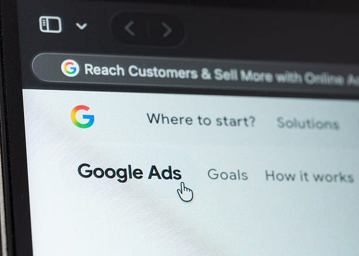 A close-up of a Google Ads solutions service displayed from a laptop's screen.