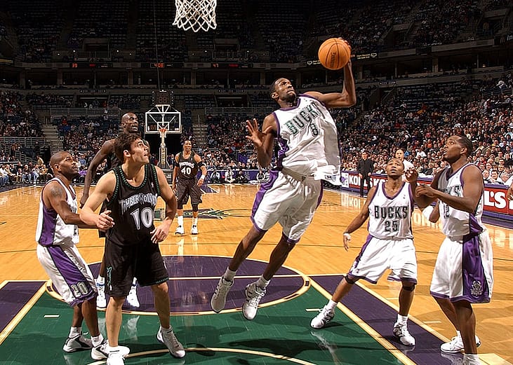 Milwaukee Bucks' #8 Joe Smith grabbing a rebound in front of teammate Michael Redd #22 and Wally Szczerbiak #10 of the Minnesota Timberwolves during their game at Bradley Center in Milwaukee, Wisconsin, USA.