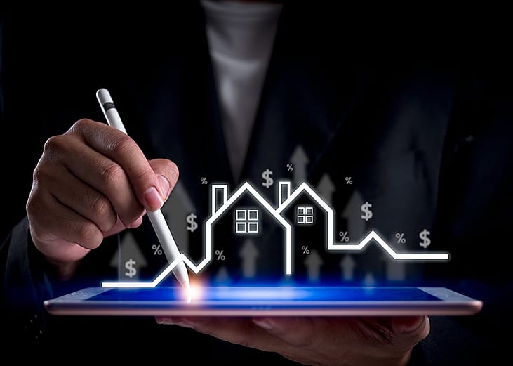 A financial specialist analyzing the real estate industry and its market growth on a digital tablet.