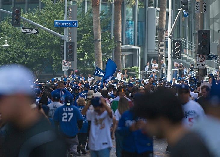 Sports fans gathering around during the Los Angeles Dodgers championship celebration in downtown Los Angeles, California, USA.