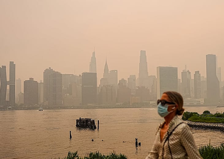 Smoke from massive wildfires in Canada engulfed the New York City skyline, reducing visibility and casting an orange haze over the New York City, United States on July 16, 2026.
