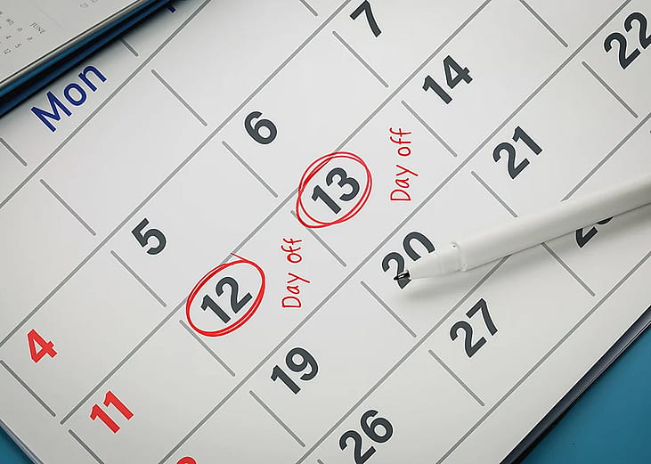 Dates marked in red for day off reminders on a calendar.