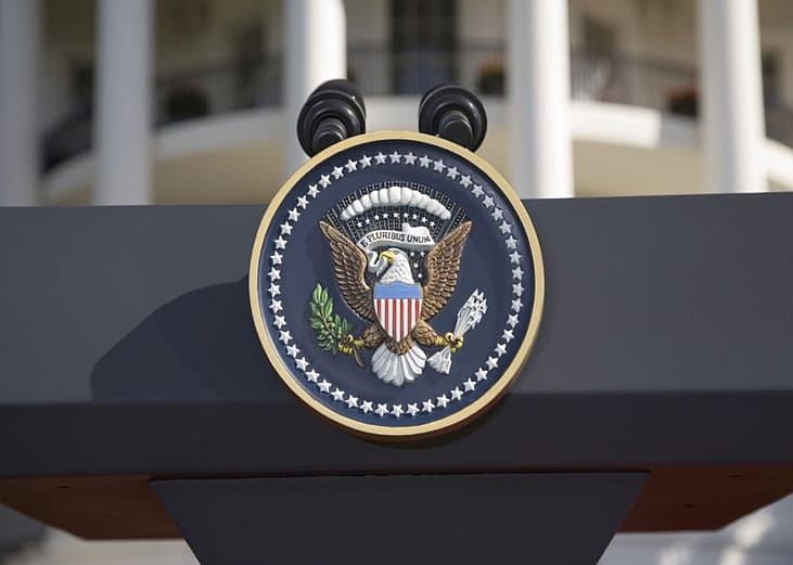 The U.S. seal on a podium.