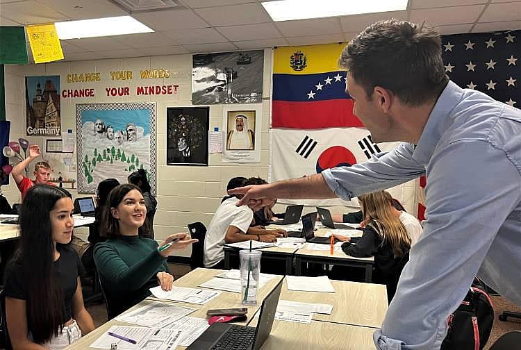 History teacher Matthew Vriesman (right) works with students at East Kentwood High School in western Michigan. Vriesman says the 250th anniversary of the Declaration of Independence is a perfect time to get students to think deeply about the Declaration’s vision of “all men created equal” and ask: How’s that experiment going?