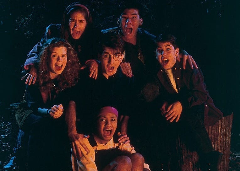 A group of scared kids in the woods.