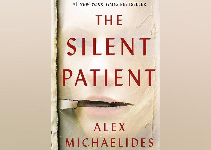 The cover features a faded photo of a woman's face with a rip over her mouth.