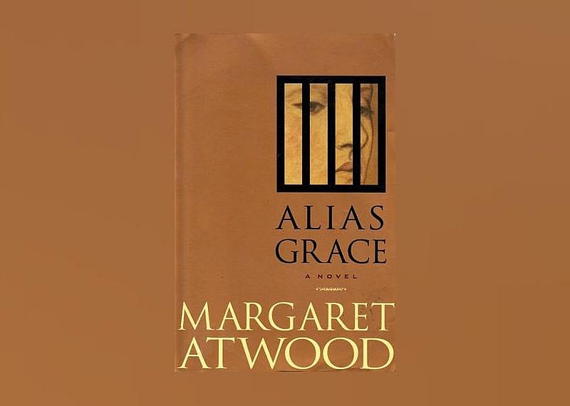 The cover shows the close-up of a women's face behind black bars. 