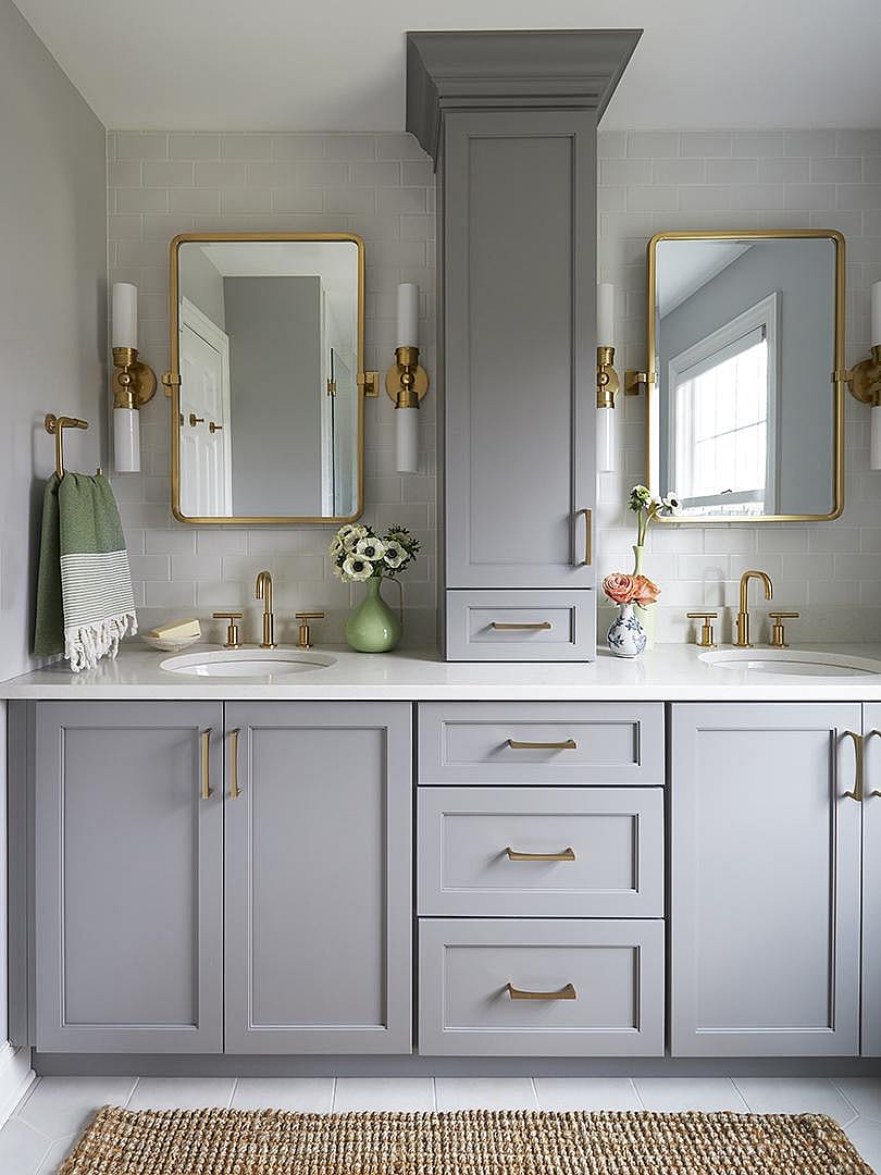 Bathroom with tall vertical cabinet and countertop towers.