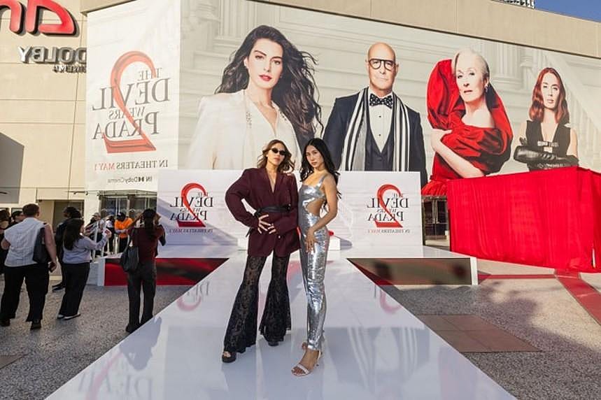 Attendees pose during a promotional event for The Devil Wears Prada 2 held at Westfield Century City in Los Angeles.