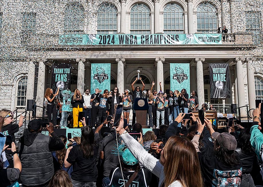 Members of the New York Liberty team celebrate their championship at a ticker tape parade. — Craig T Fruchtman // Getty Images